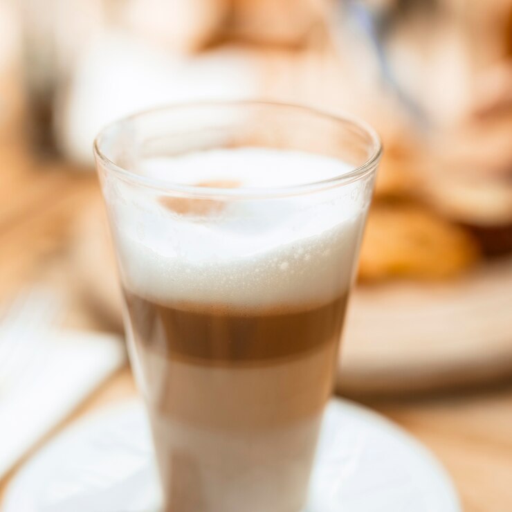 close-up-multilayer-coffee-glass-with-foam_23-2147908390
