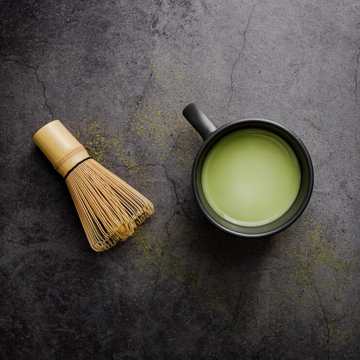 top-view-matcha-tea-cup-with-bamboo-whisk_23-2148378934